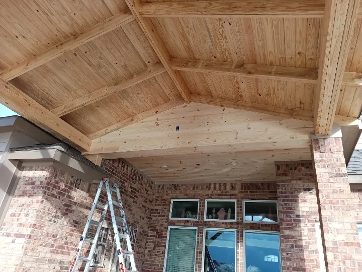 Vaulted tongue-and-groove wood ceiling on a new covered patio in Pearland TX