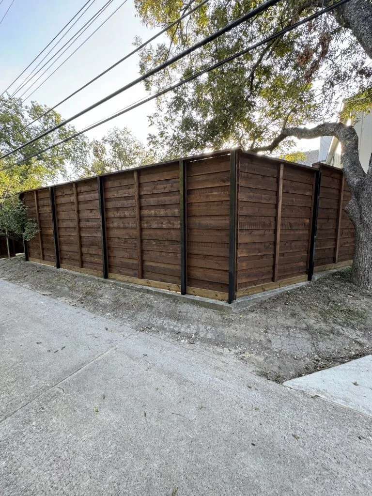 Horizontal cedar fence on black steel posts in Pearland TX
