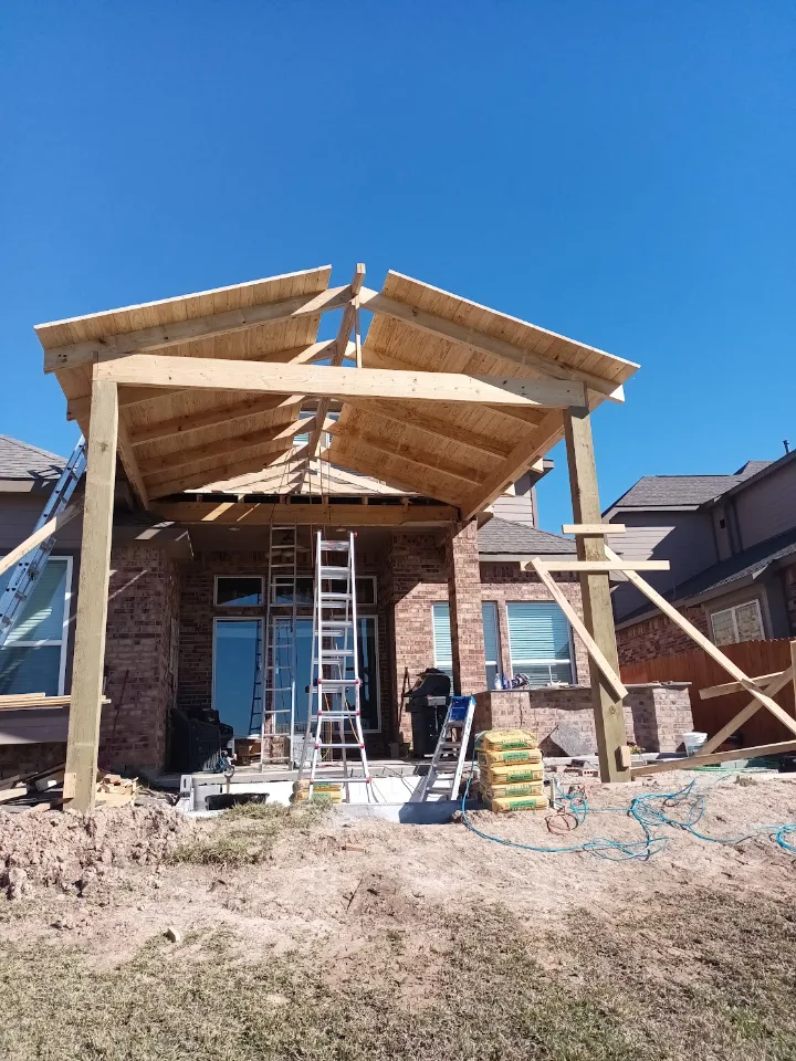 Gable roof covered patio framing under construction on a Pearland TX home